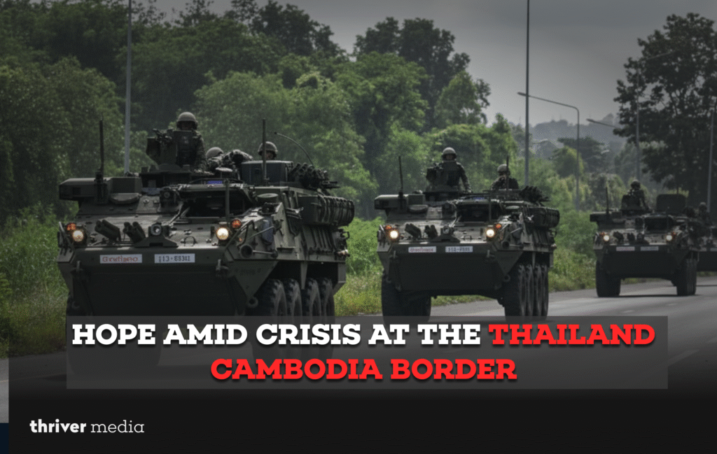 Hope Amid Crisis at the Thailand Cambodia Border 5 Armored vehicles with troops moving along a forested road near the Thailand–Cambodia border during a period of conflict.