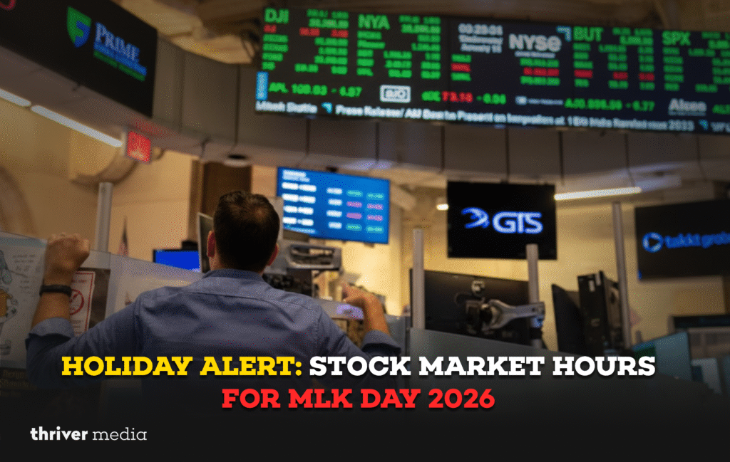 A stock trader looks up at digital market boards inside a trading floor as screens display NYSE and stock index data during market hours.
