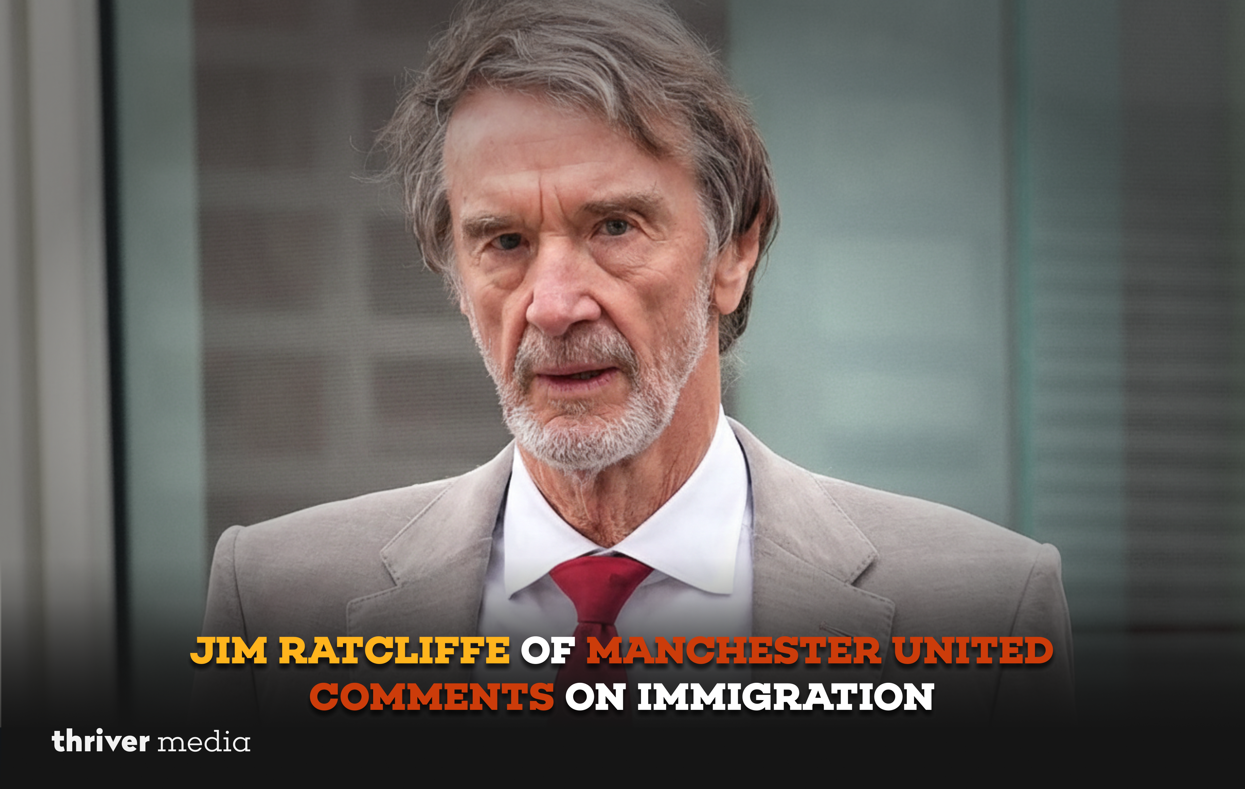 A senior Manchester United co-owner wearing a grey suit and red tie, photographed outdoors with a serious expression.