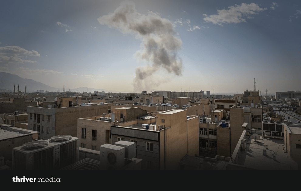 US, Israel Hit Iran as Tehran Explodes in Chaos 2 Smoke rising over residential buildings in Tehran after reported explosions during US-Israel strikes on Iran.