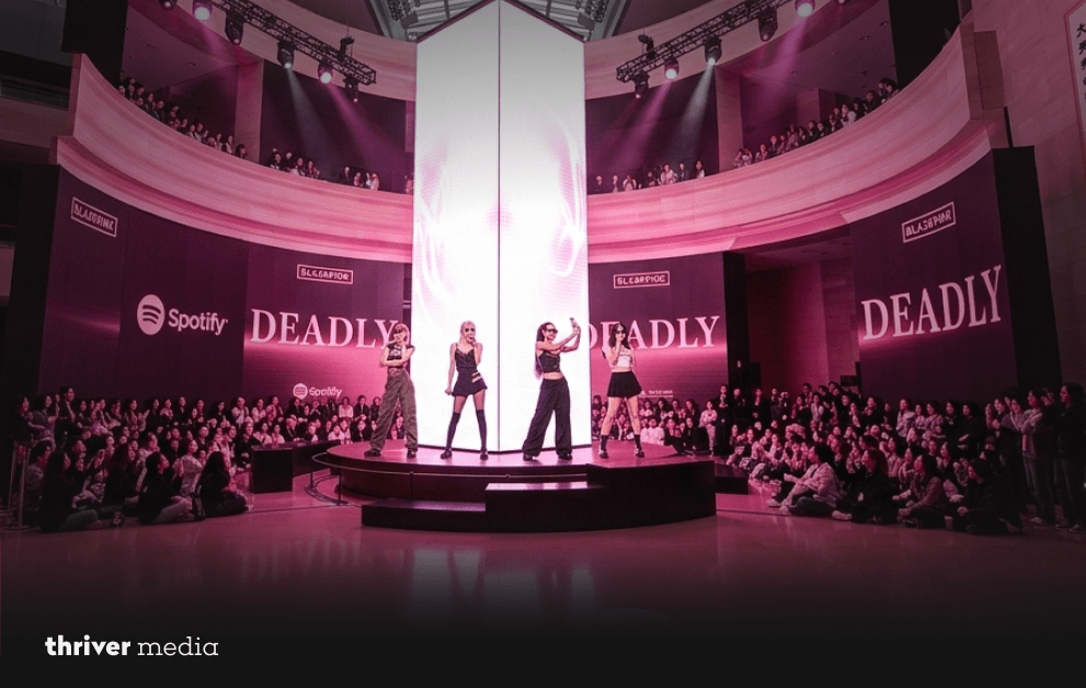 BLACKPINK performs inside the National Museum of Korea under pink lighting during their DEADLINE listening event.